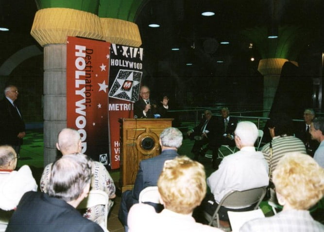 Man speaks in front of crowd