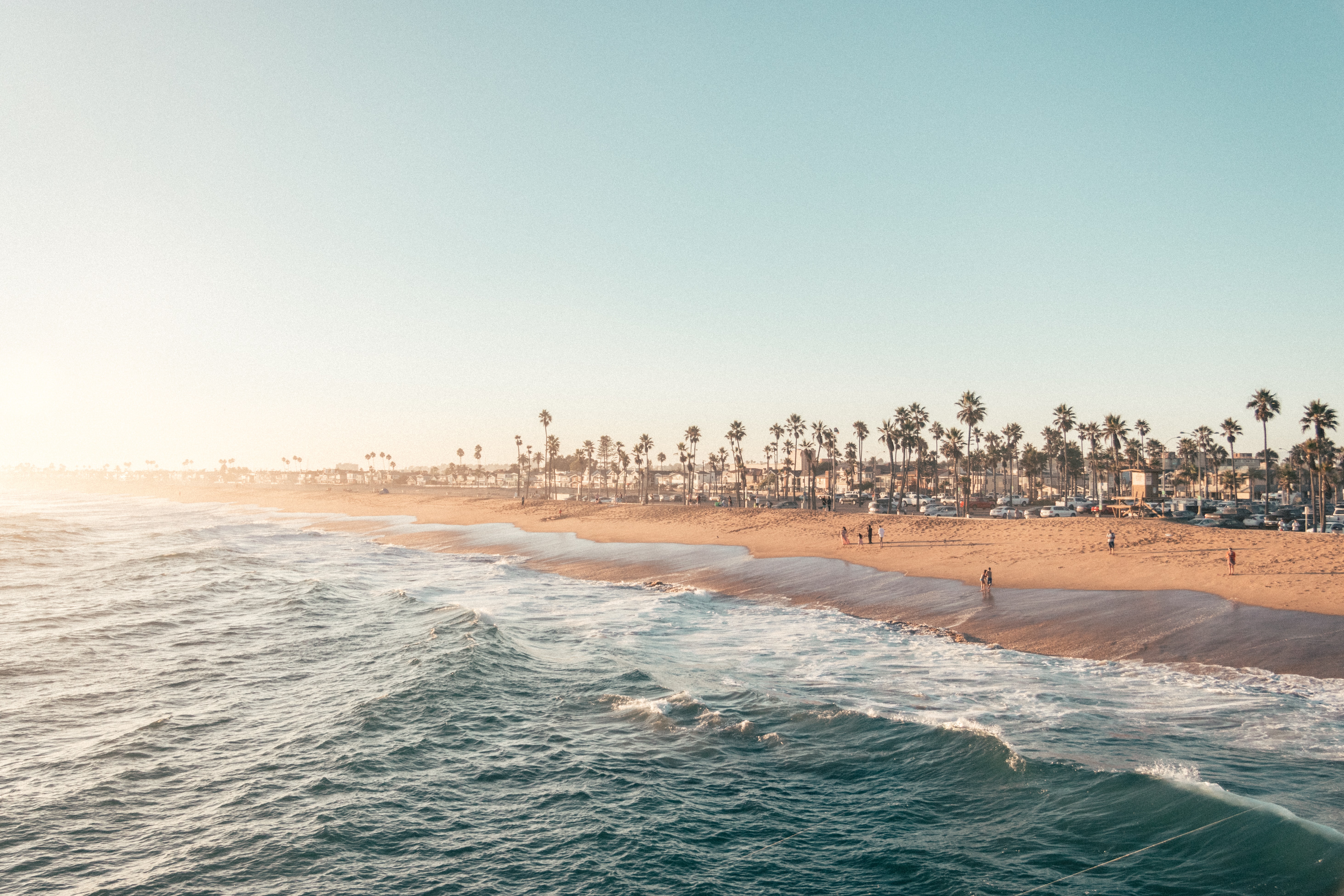 Photograph of the ocean and beach at Balboa Pier in Newport Beach